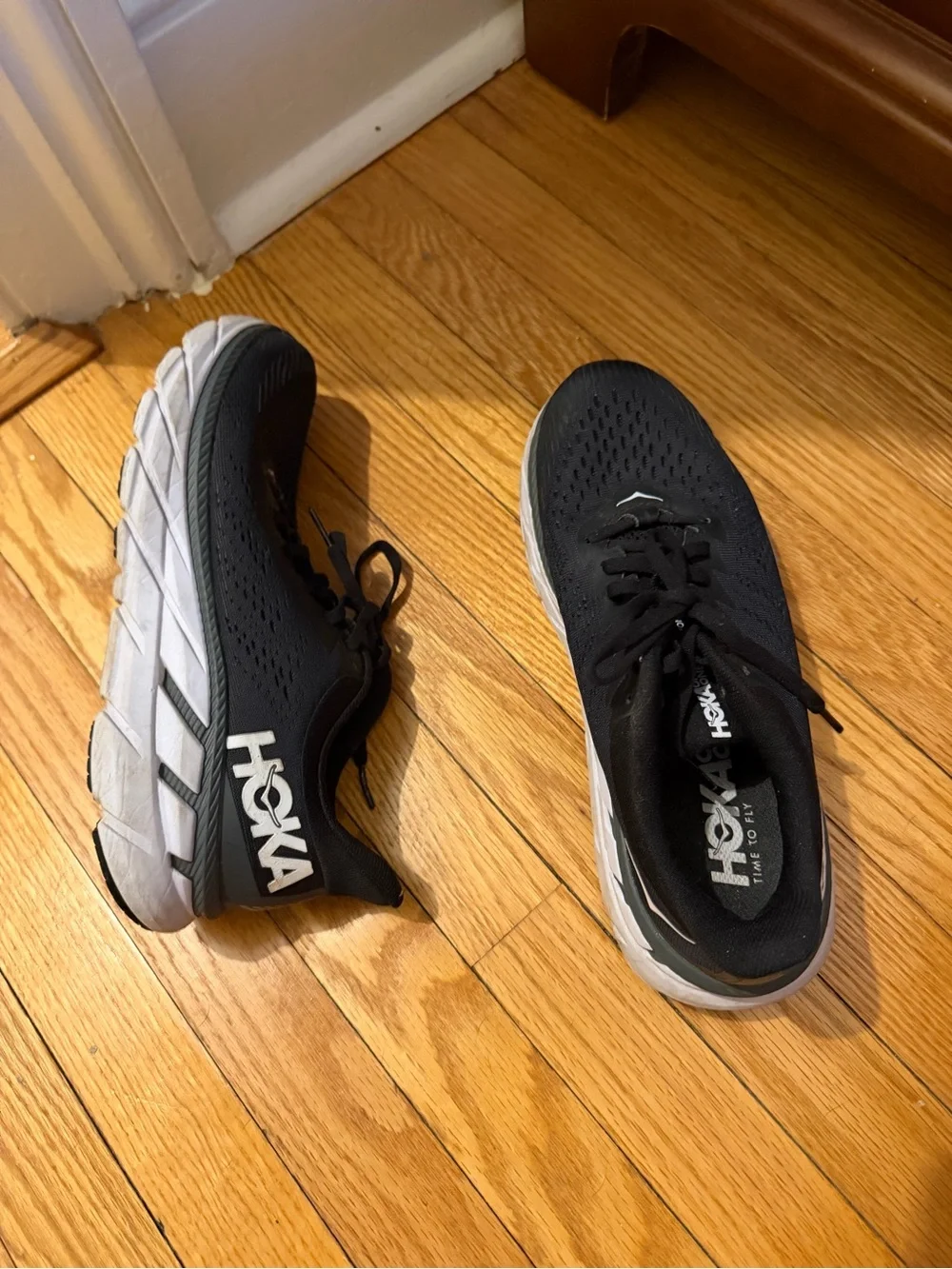 Hoka Black and White Cushioning Running Sneakers